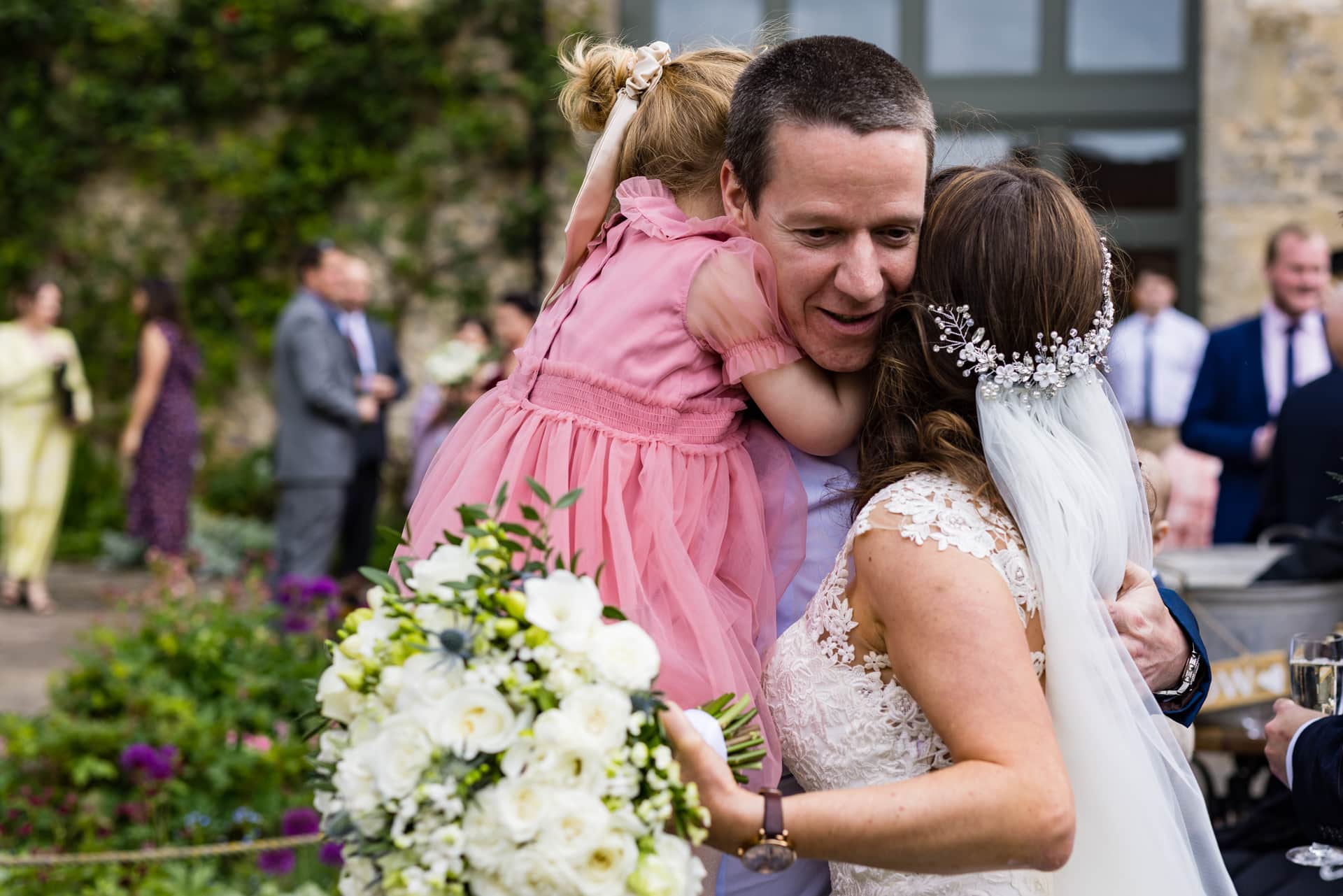 Man and daughter congratulating the bride at Priston Mill Wedding Venue