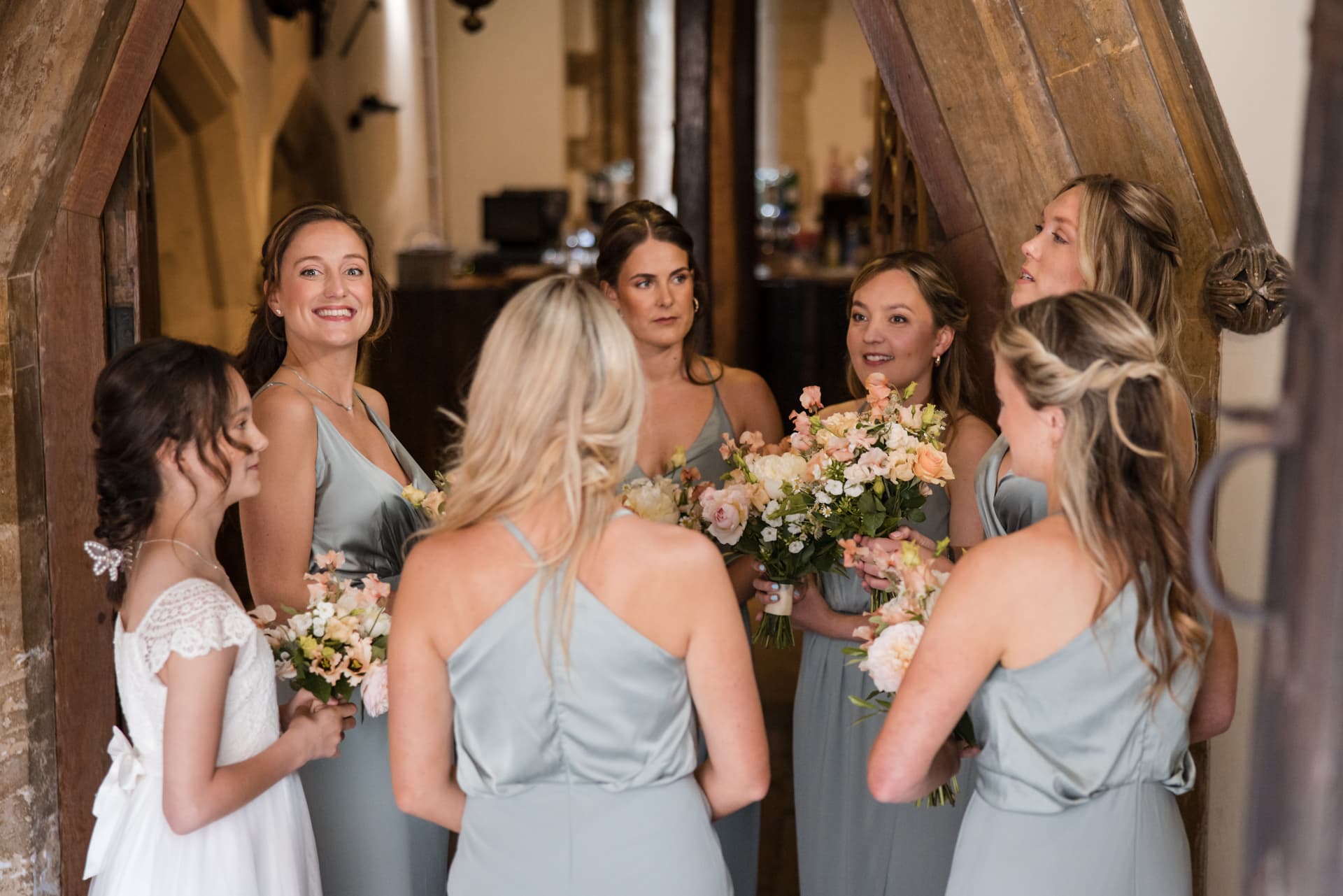 excited bridesmaids waiting for bride