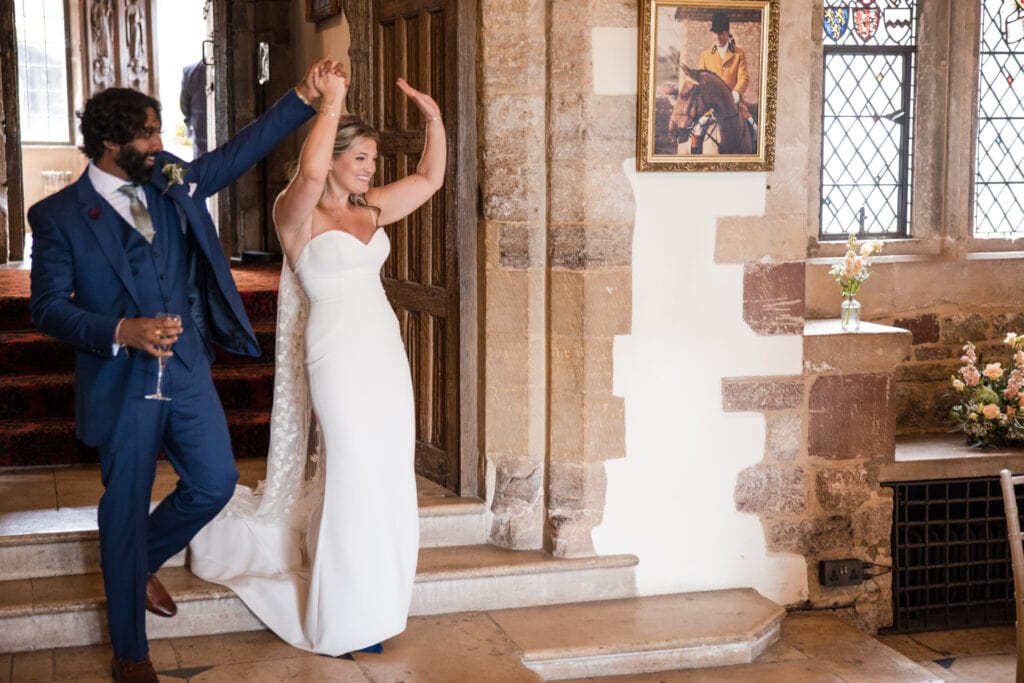 Bride and Groom walk into the Wedding reception