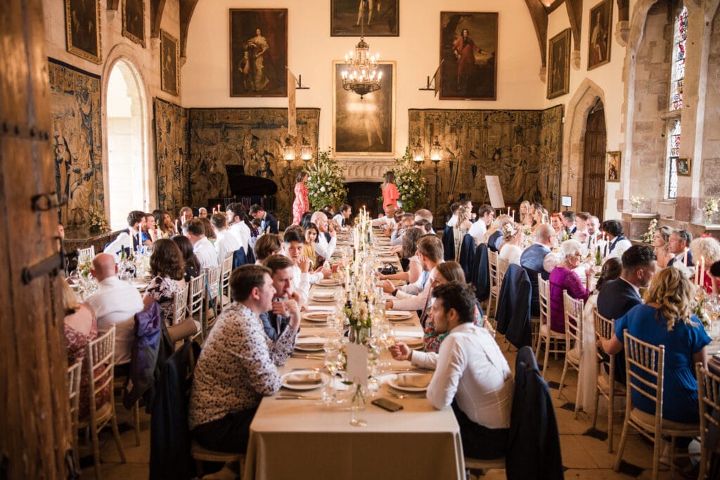 All seated in the grand hall for wedding breakfast at the Berkeley Castle Wedding Venue