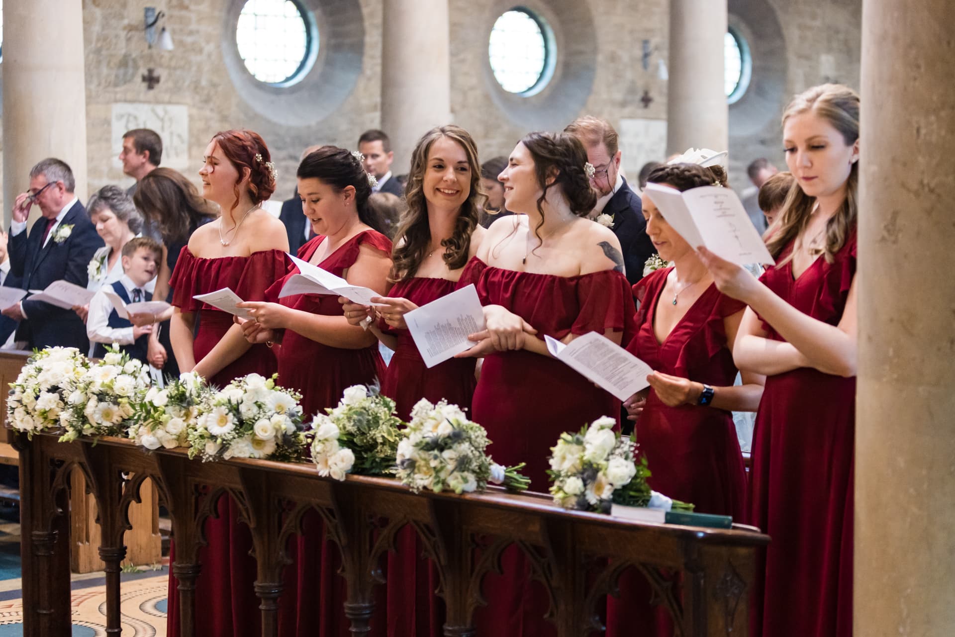 bridesmaids singing in the church