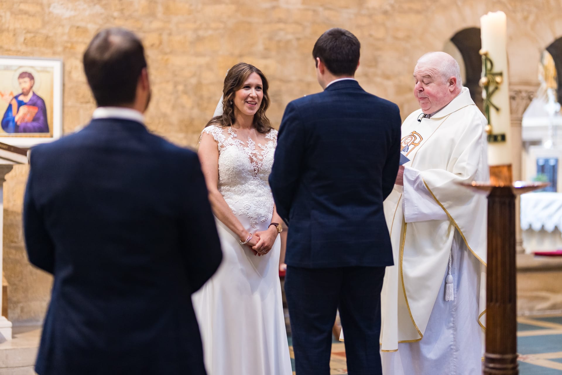 Bride and Groom talking to the vicar