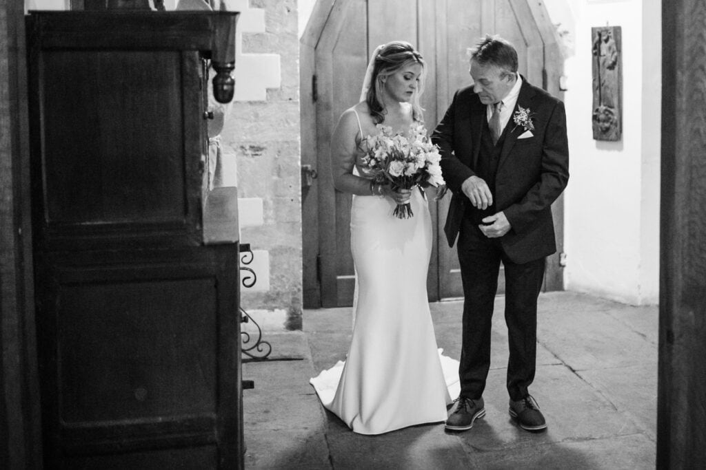 Father and Bride waiting outside to walk into ceremony