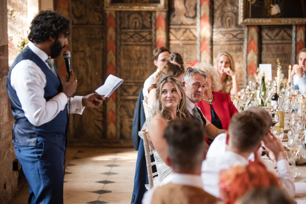 Groom speech with his bride onlooking at Berkeley Castle Wedding Venue