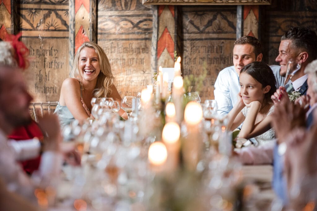 Wedding guests laughing during speeches
