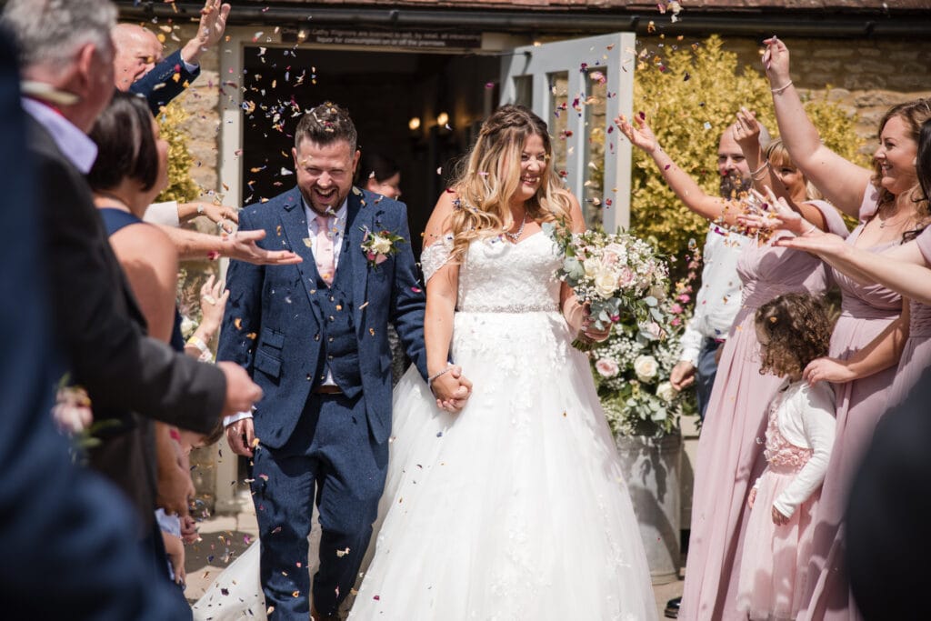 Bride and groom confetti walk