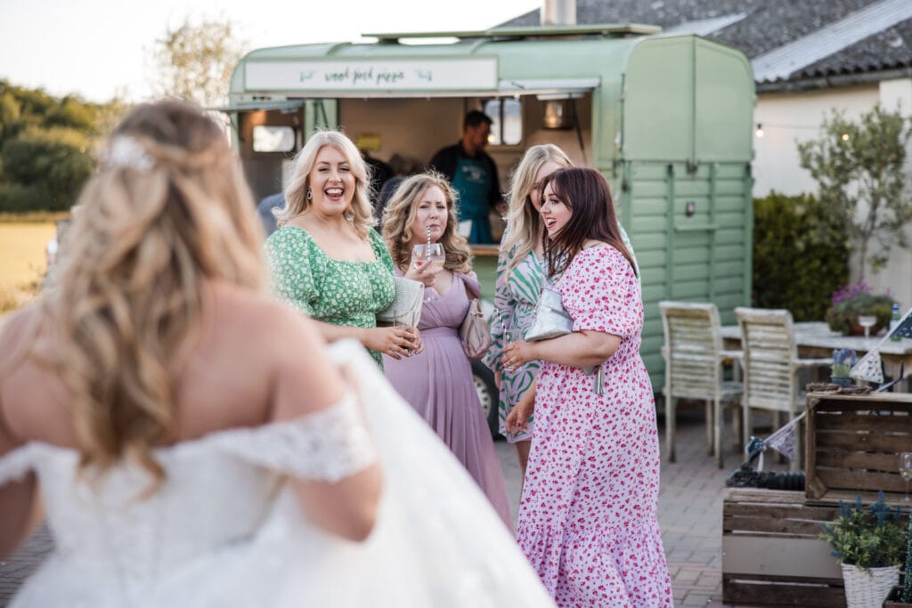 Girlfriends of the bride excited to see the bride