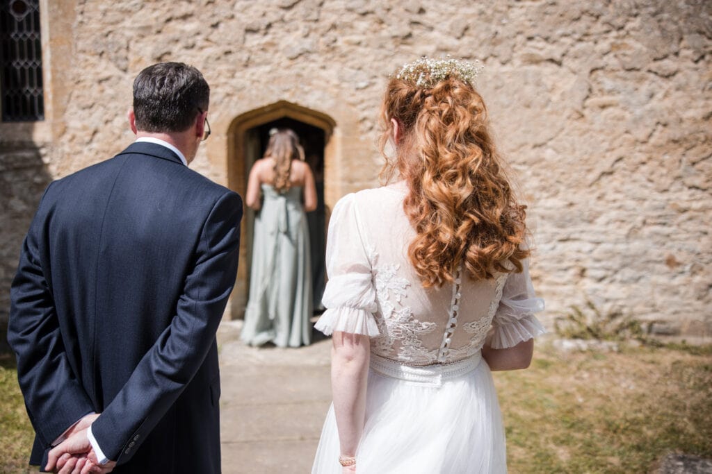 Father and Bride waiting outside the church