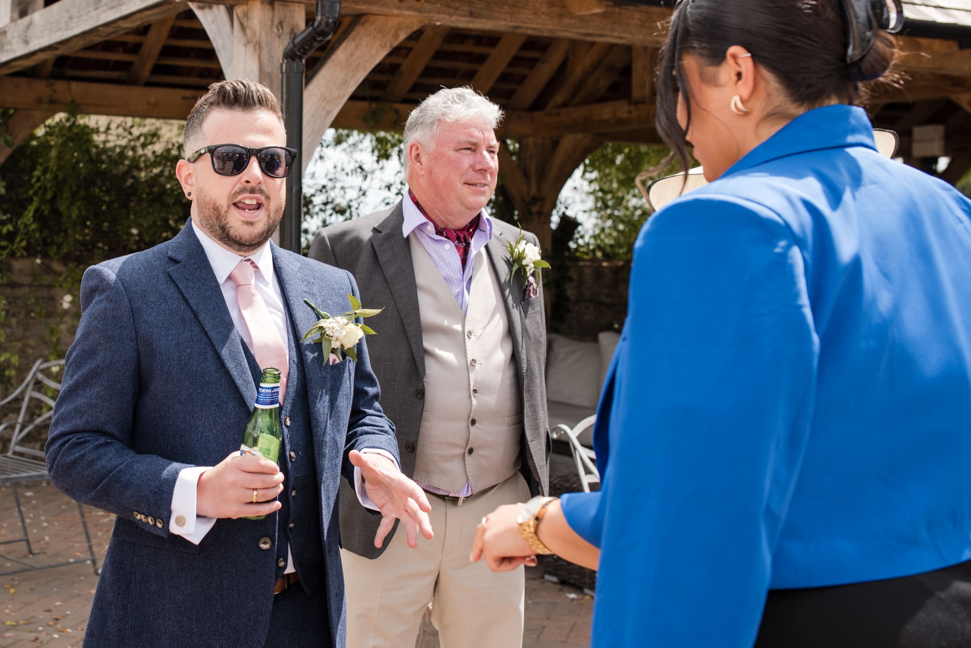 Groom talking to guests