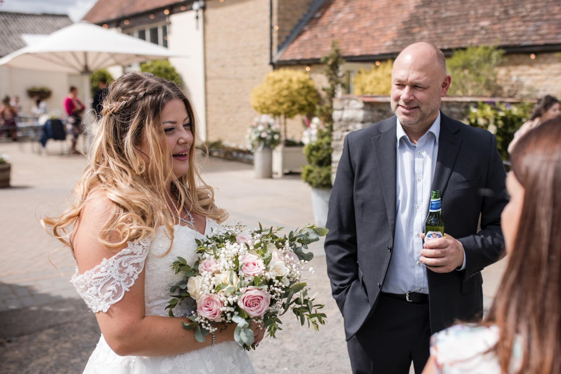 Bride talking to guests at Stratton Court Barn Wedding Venue