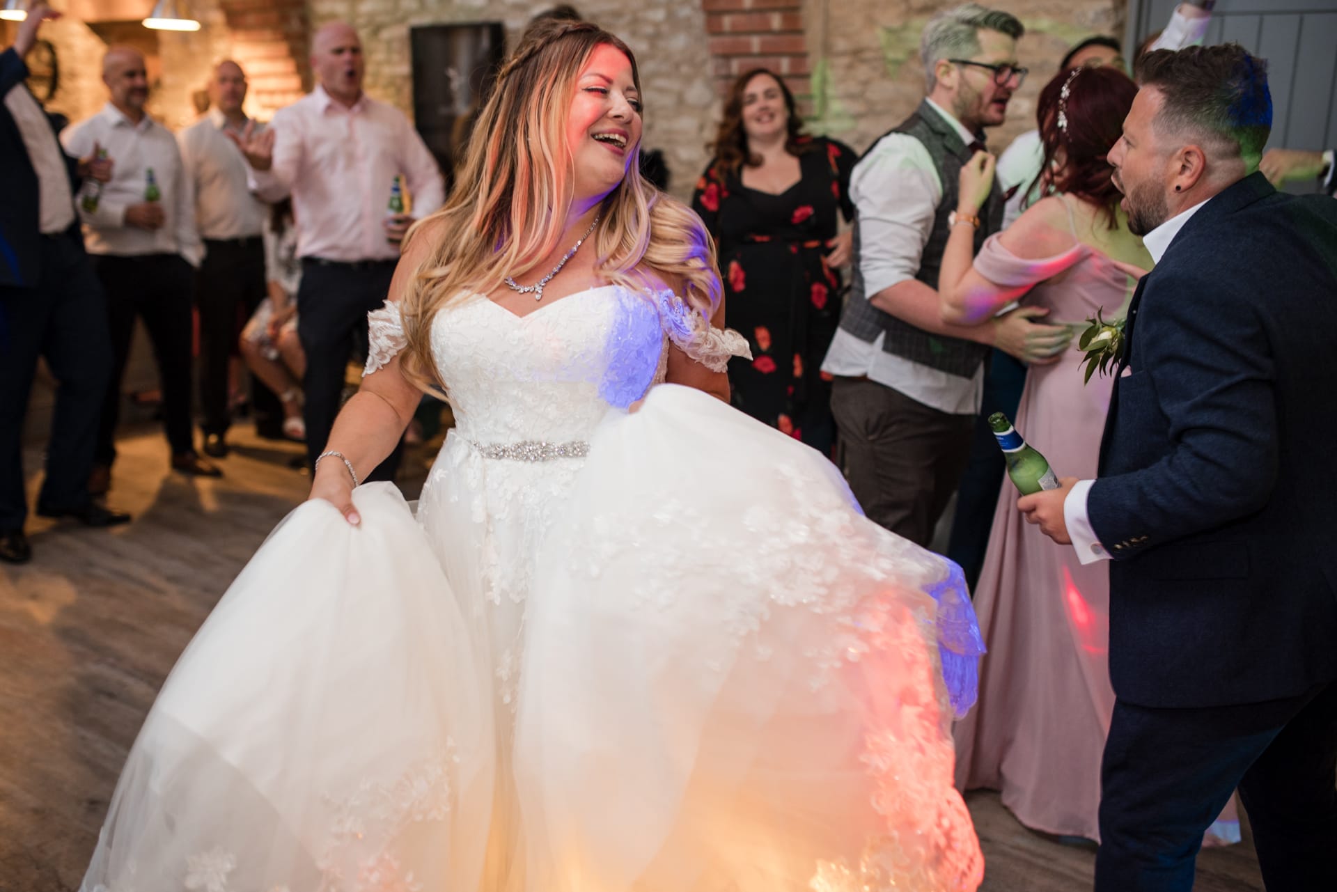 Bride and Groom dancing at the Stratton Court Barn Wedding Venue
