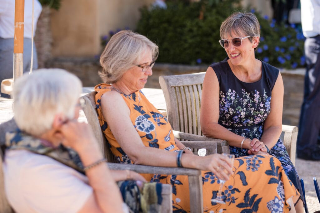 Wedding guests talking in the garden