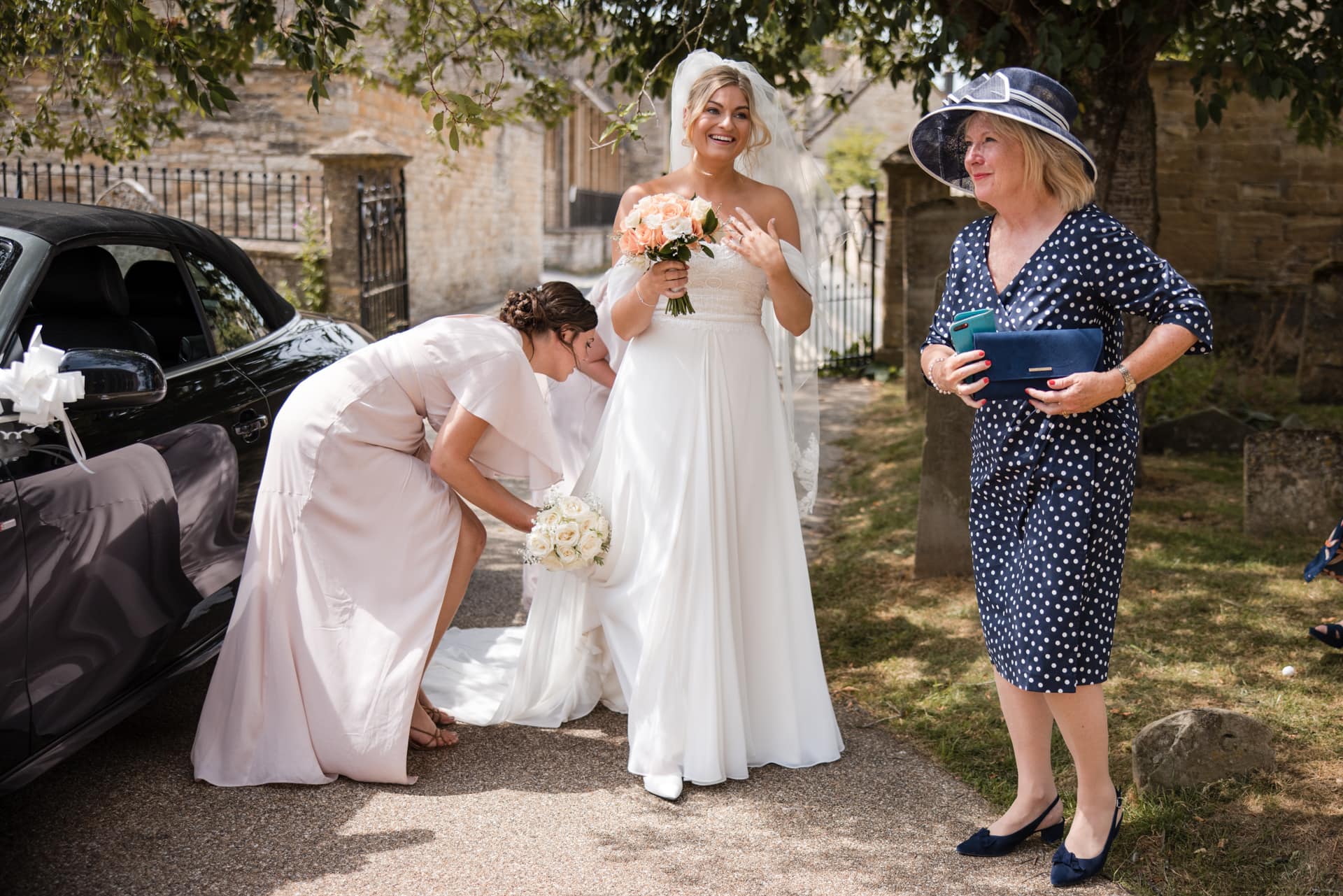 Bride and mother outside the church, Burford Wedding, Oxleaze Barn
