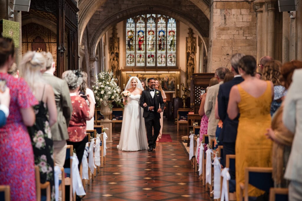 Bride and Groom walking down the aisle