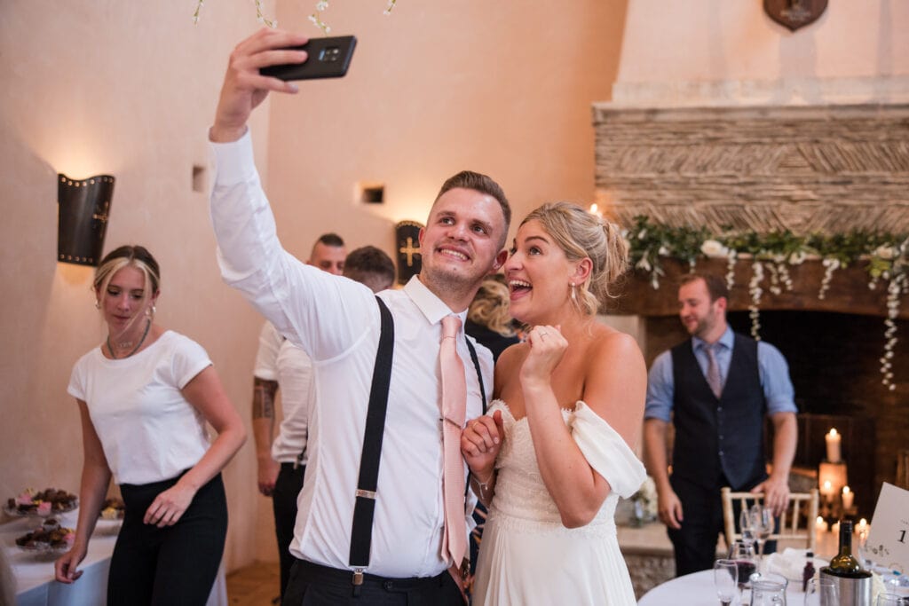 Bride and Groomsman Selfie inside Oxleaze Barn