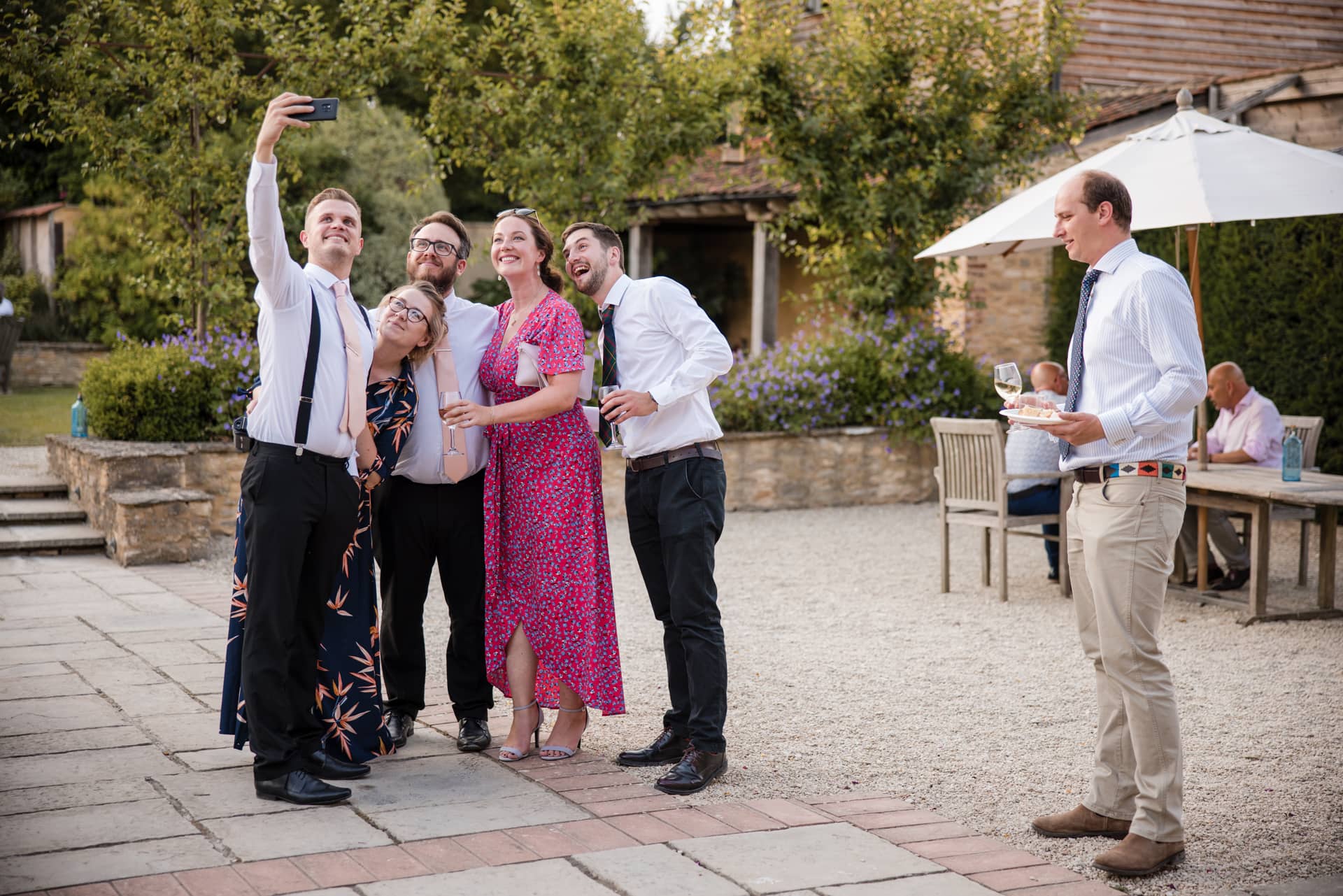 Guests taking a selfie at Oxleaze Barn Wedding