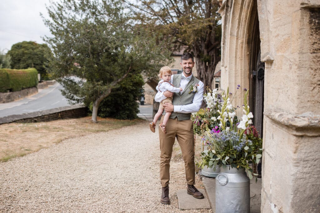 Groom waiting outside the All Saints Church, Sutton Benger