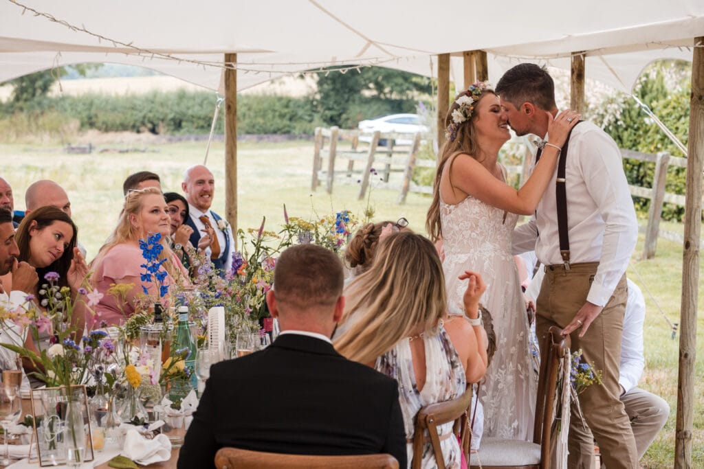 Bride kissing the groom after speech