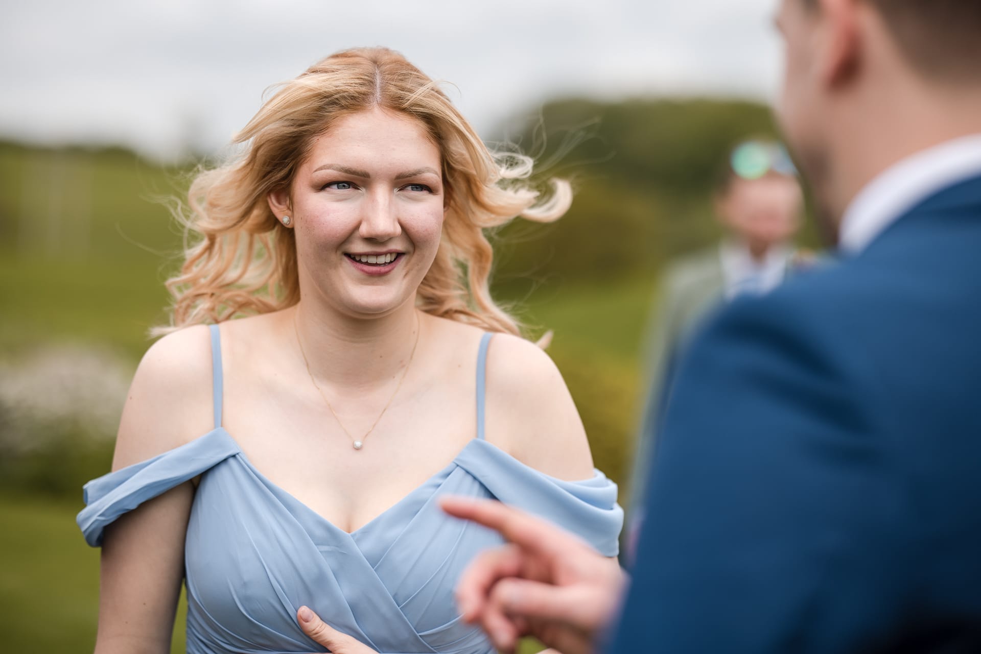 Bridesmaid with her hair catching the wind