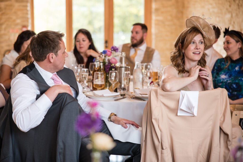 Guests listening to the speeches at Kingscote Barn