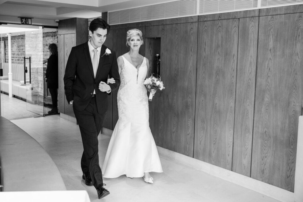 Bride and son entering the wedding ceremony at Le Manoir
