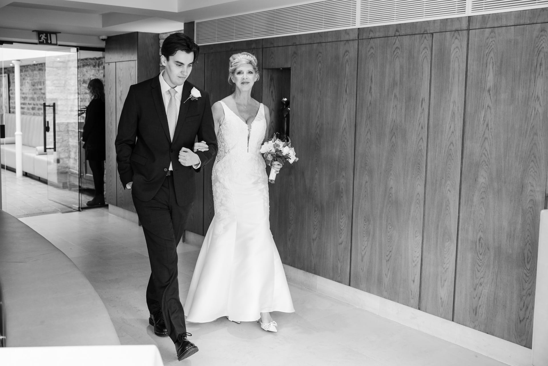 Bride and son entering the wedding ceremony at Le Manoir