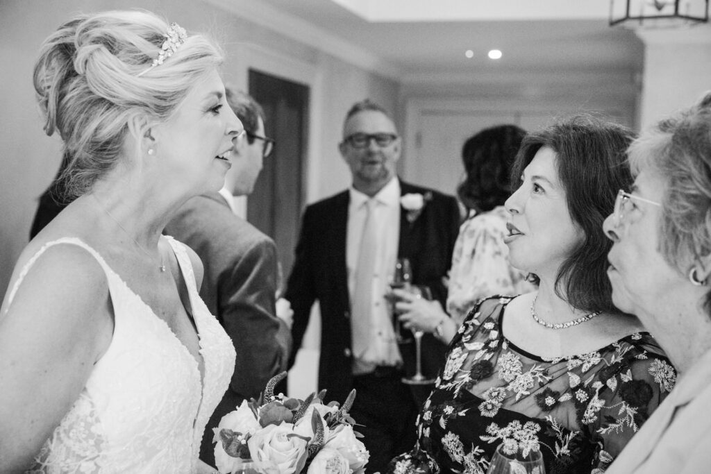Bride talking to guests at Le Manoir