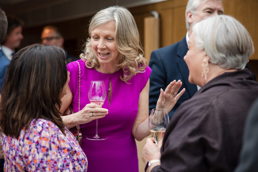 Guests chatting at during the drinks reception