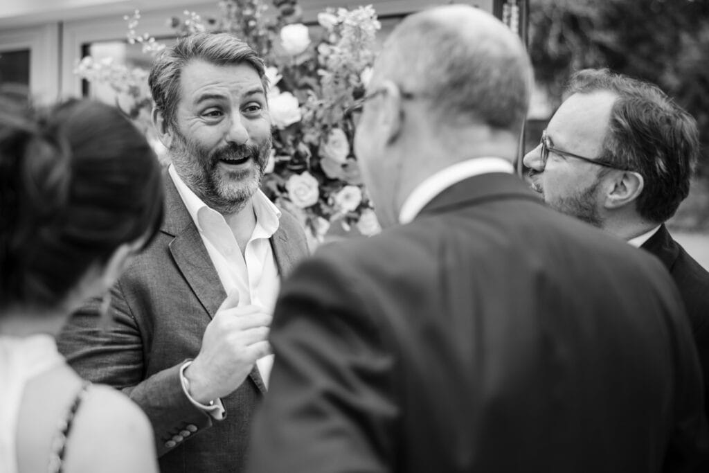 Guests catching up during the drinks reception at Le Manoir