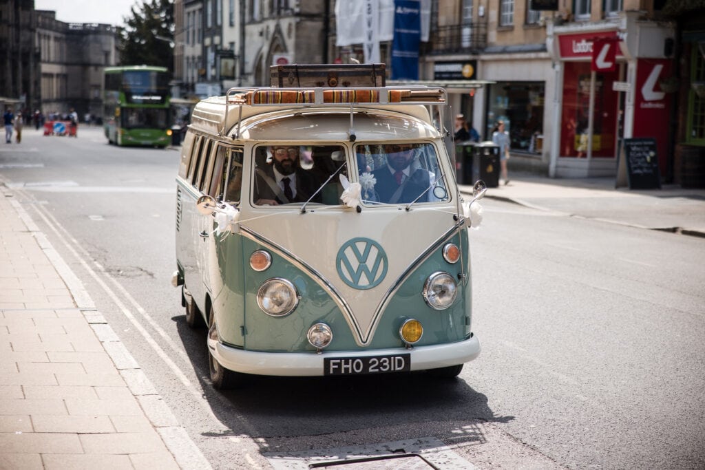 old campervan with the wedding party in the centre of Oxford
