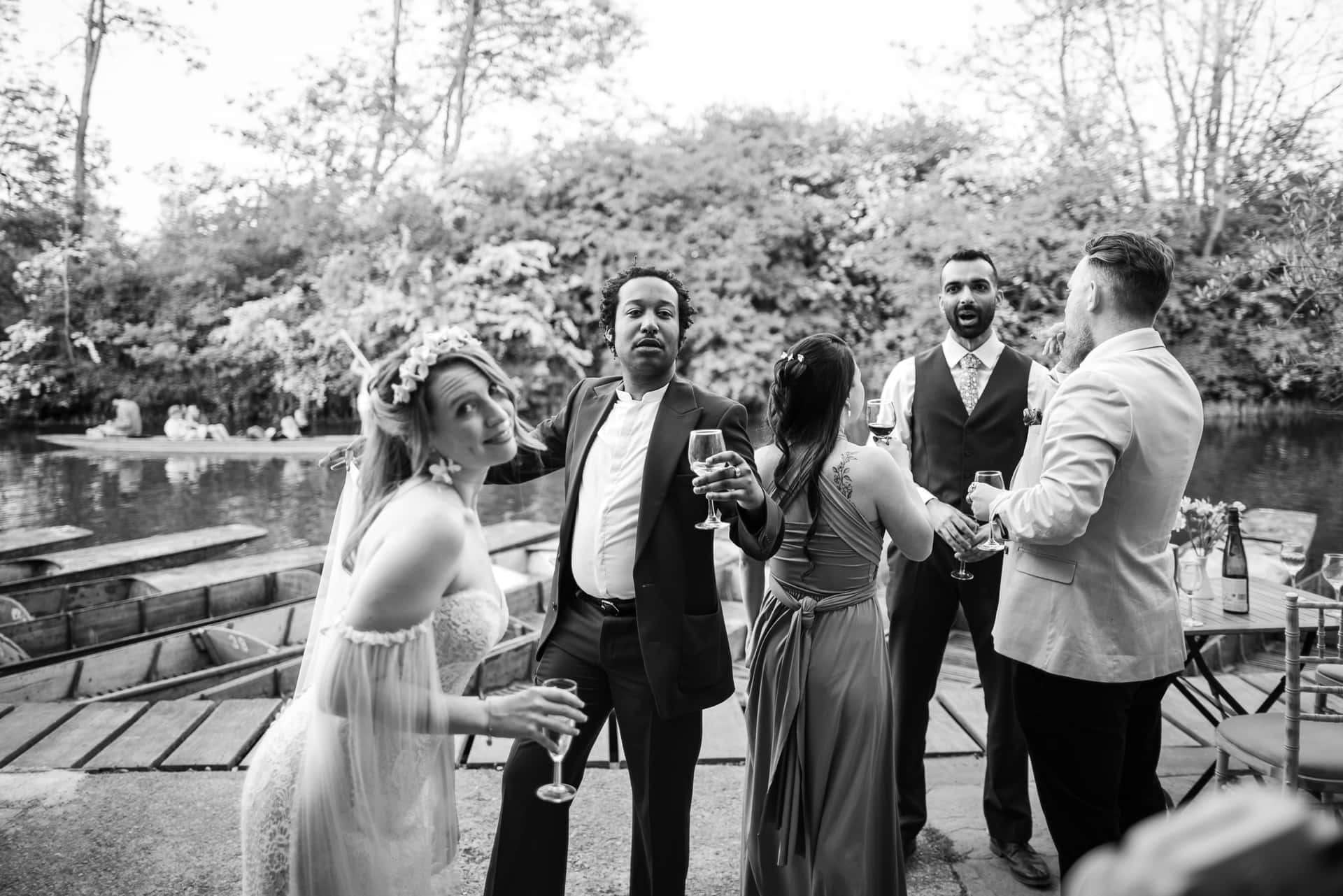 Wedding Guests and Bride having fun at the Cherwell Boathouse with the Cherwell and punts in the background.