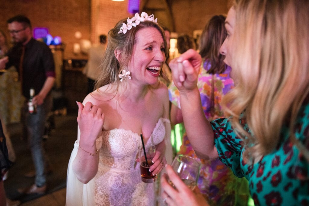 The Bride laughing at something that has just happened.