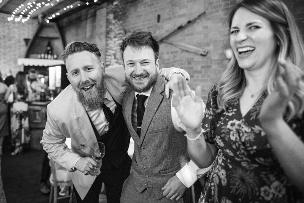 Groomsman and Friends dancing and laughing