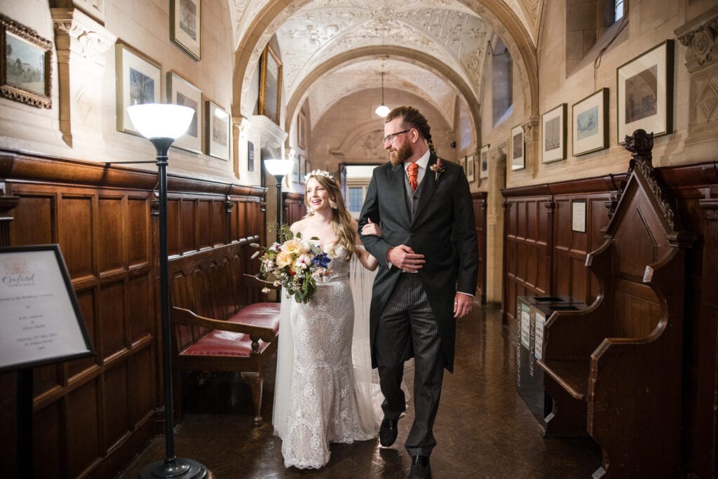 Bride and Brides friend walking towards the registry office at Oxfords County Hall