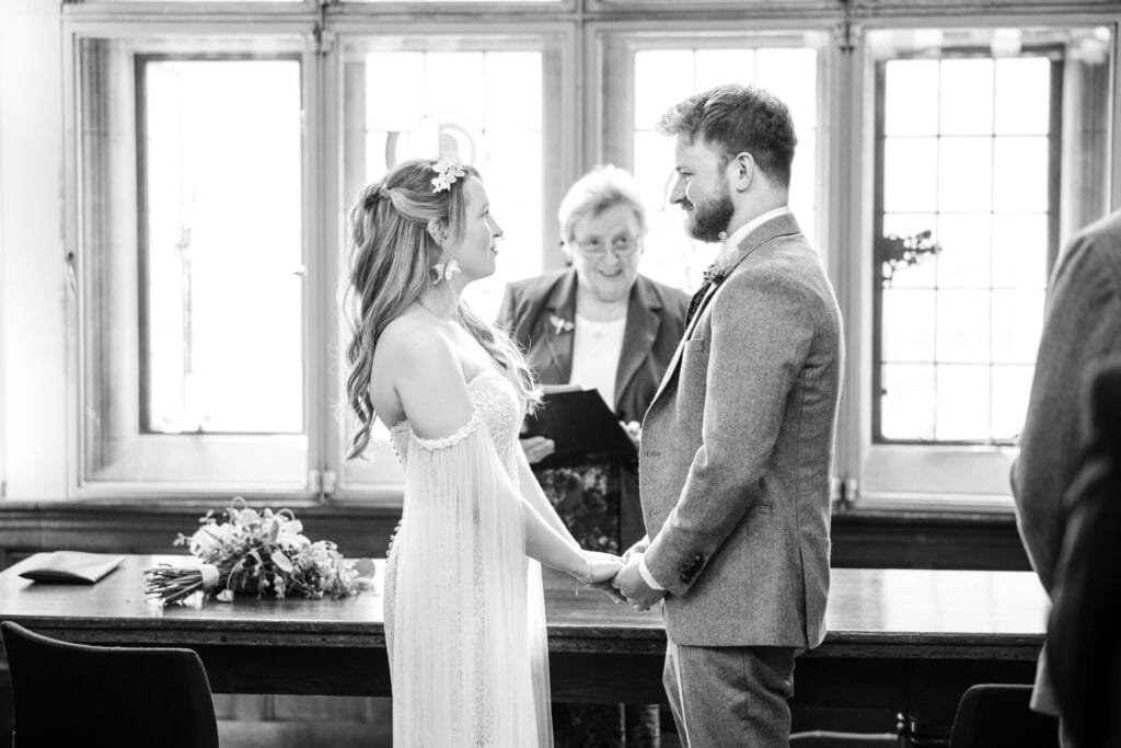 Bride and Groom looking at each other at the Oxford County Hall