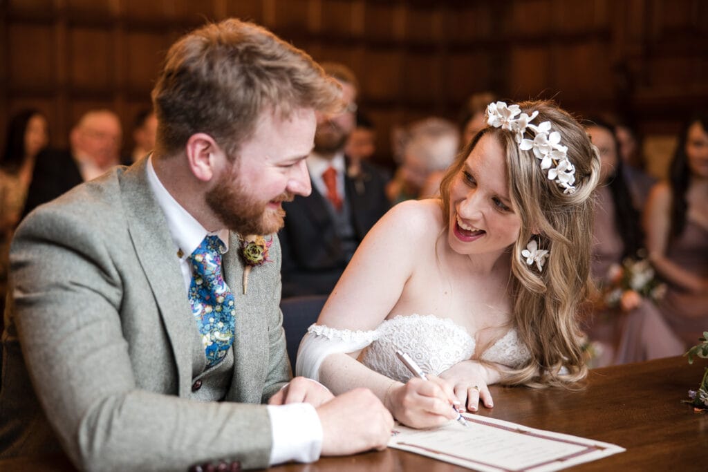 Bride and Groom sign the wedding contract at Oxford County Hall