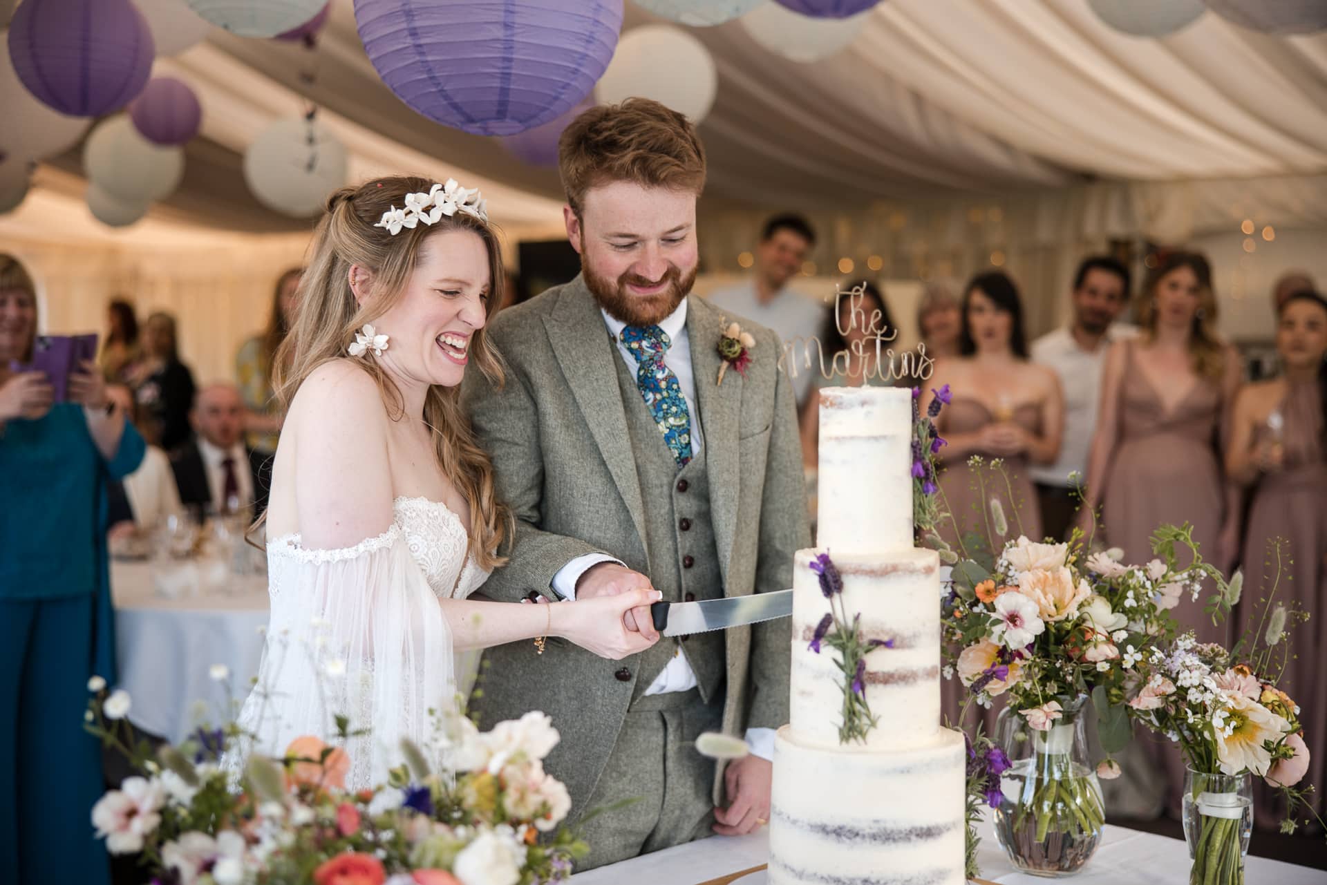 Bride and Groom cutting the wedding cake at the Cherwell Boathouse