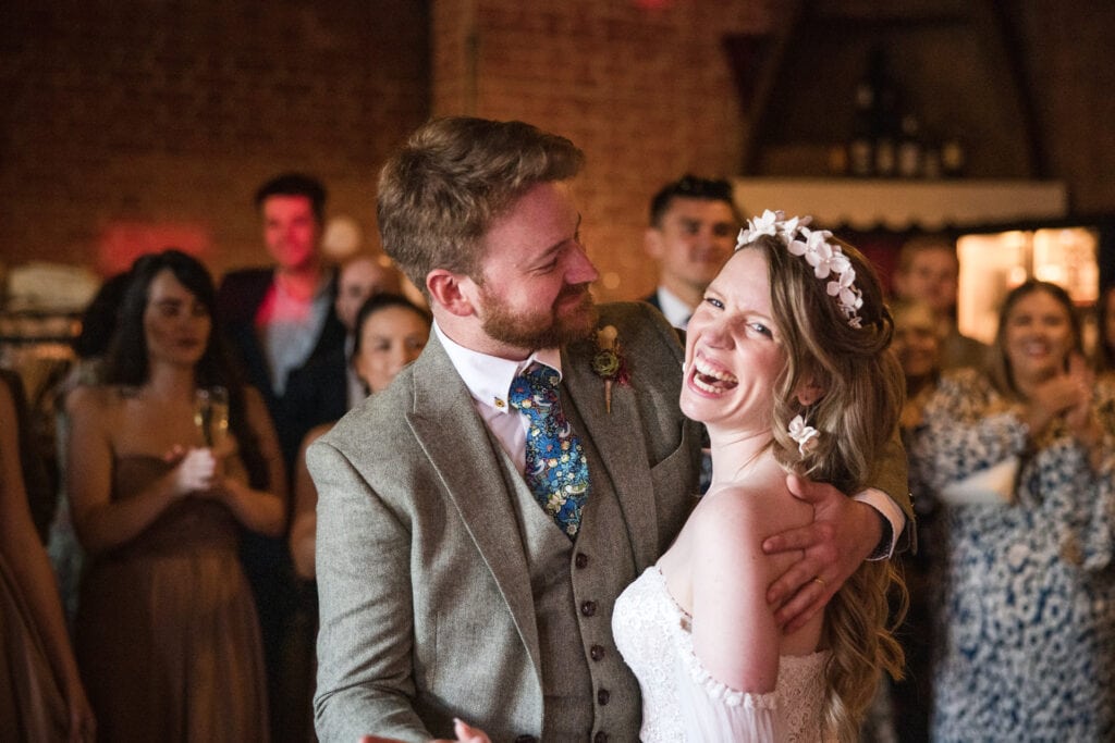 Bride and Groom cuddle after last dance at the Cherwell Boathouse