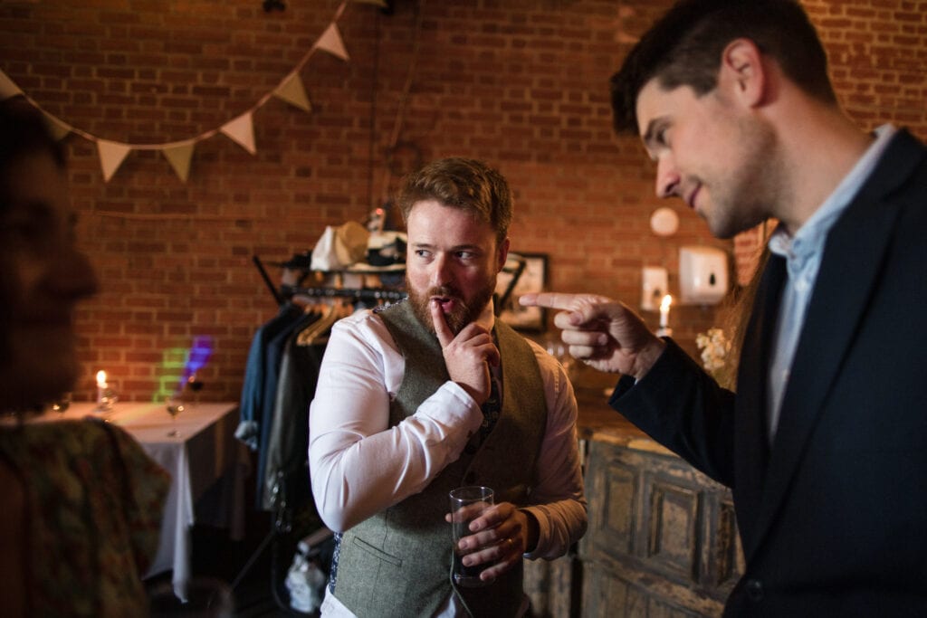The Groom and a Friend pulling funny faces at the Cherwell Boathouse