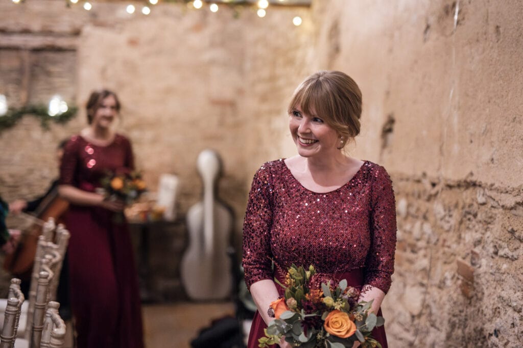 Bridesmaid looking down the aisle.