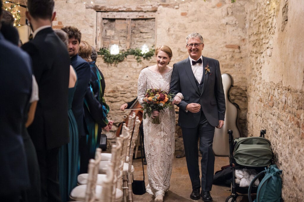 Bride and Father walking down the aisle at the Crown and Thistle.