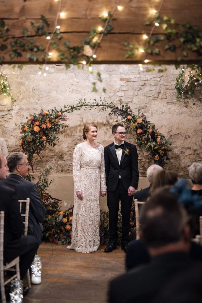 Bride and Groom listening on to the wedding speeches