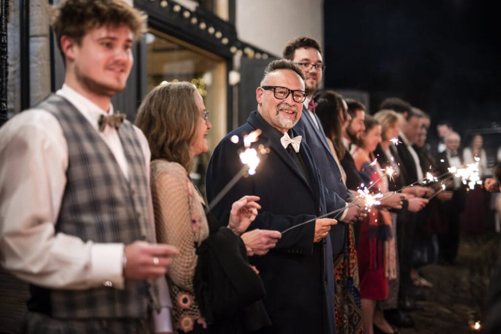 Guests waiting patiently with sparklers at the Crown and Thistle.