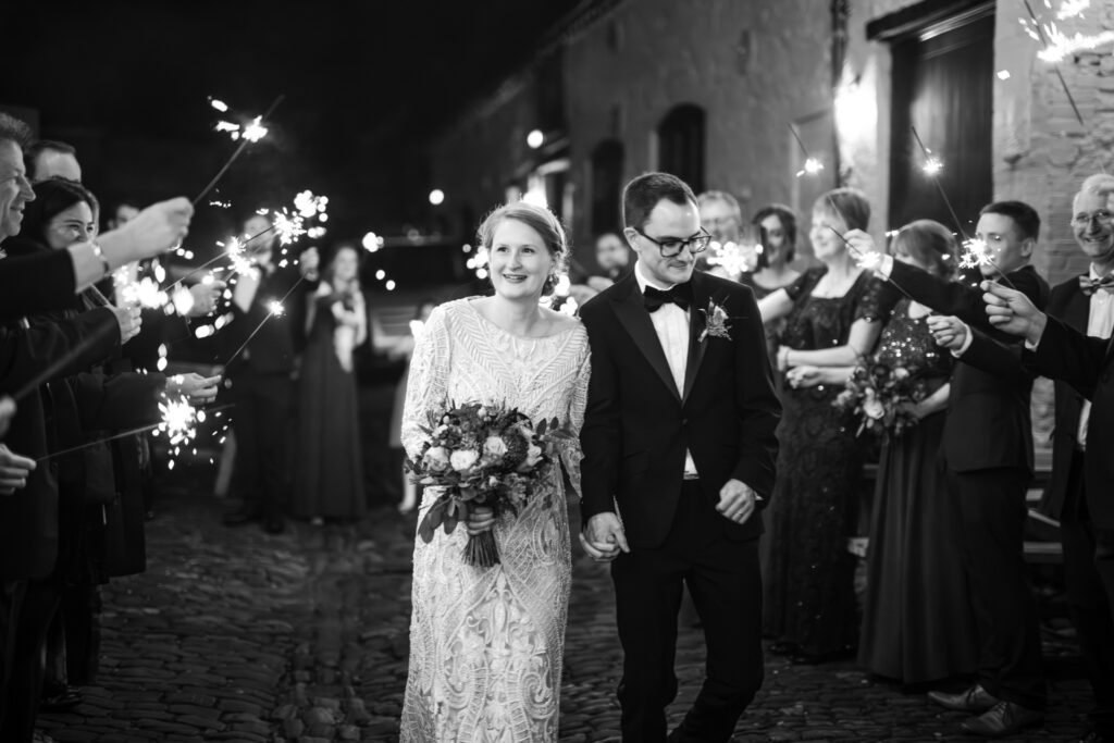 Bride and Groom walking down the sparkler line at the Crown and Thistle.