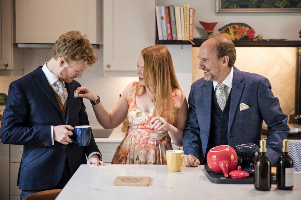 Groom and his father and Sister in the Kitchen having fun