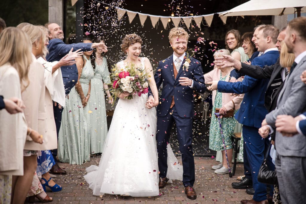 Bride and Groom confetti walk at the Gathering Barn.