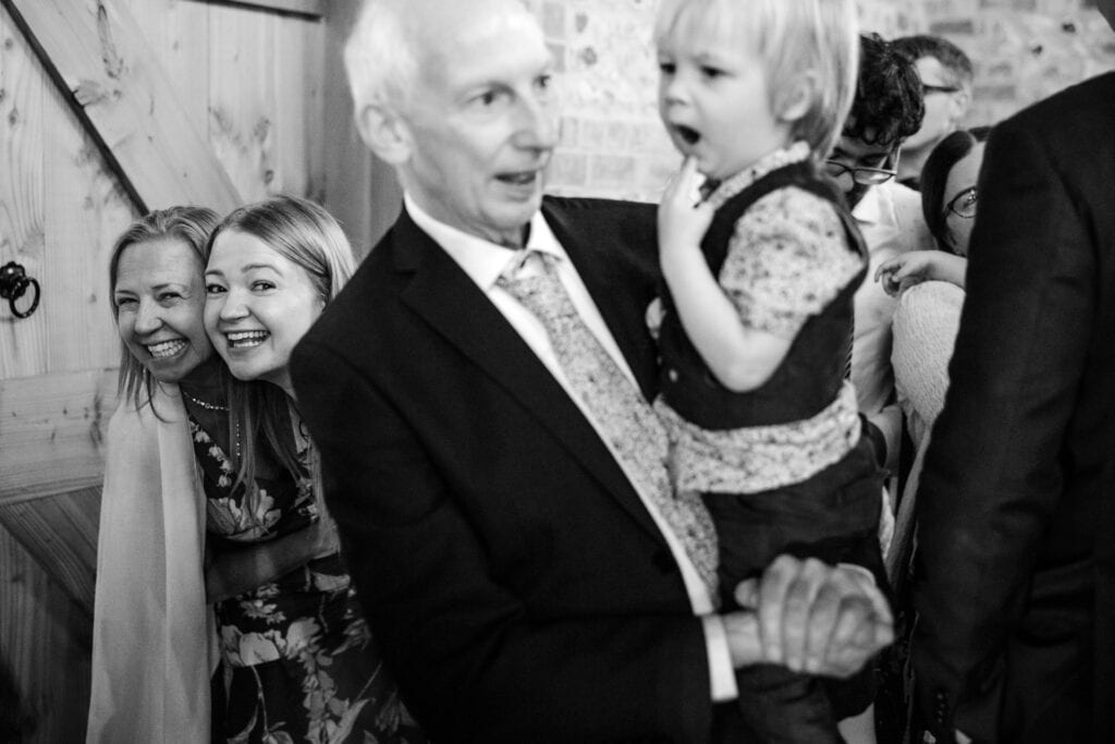 Wedding guests having fun at the Gathering Barn
