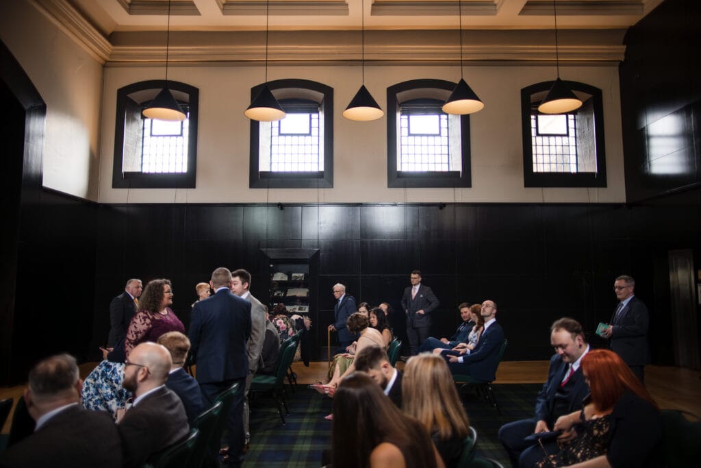Guests in a large room with Windows with bars in at the Malmaison Oxford