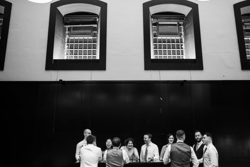 Guests drinking with a shot of the Prison windows at the Malmaison Oxford