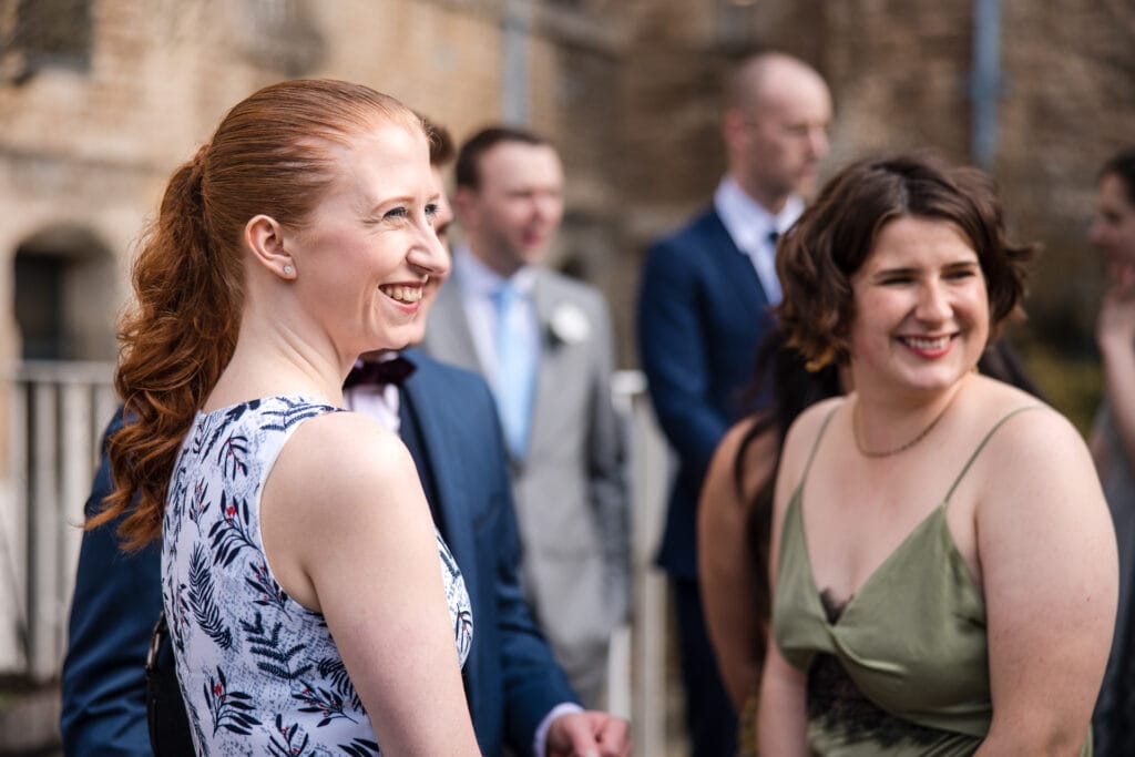 Guests smiling in the grounds of Malmaison Oxford